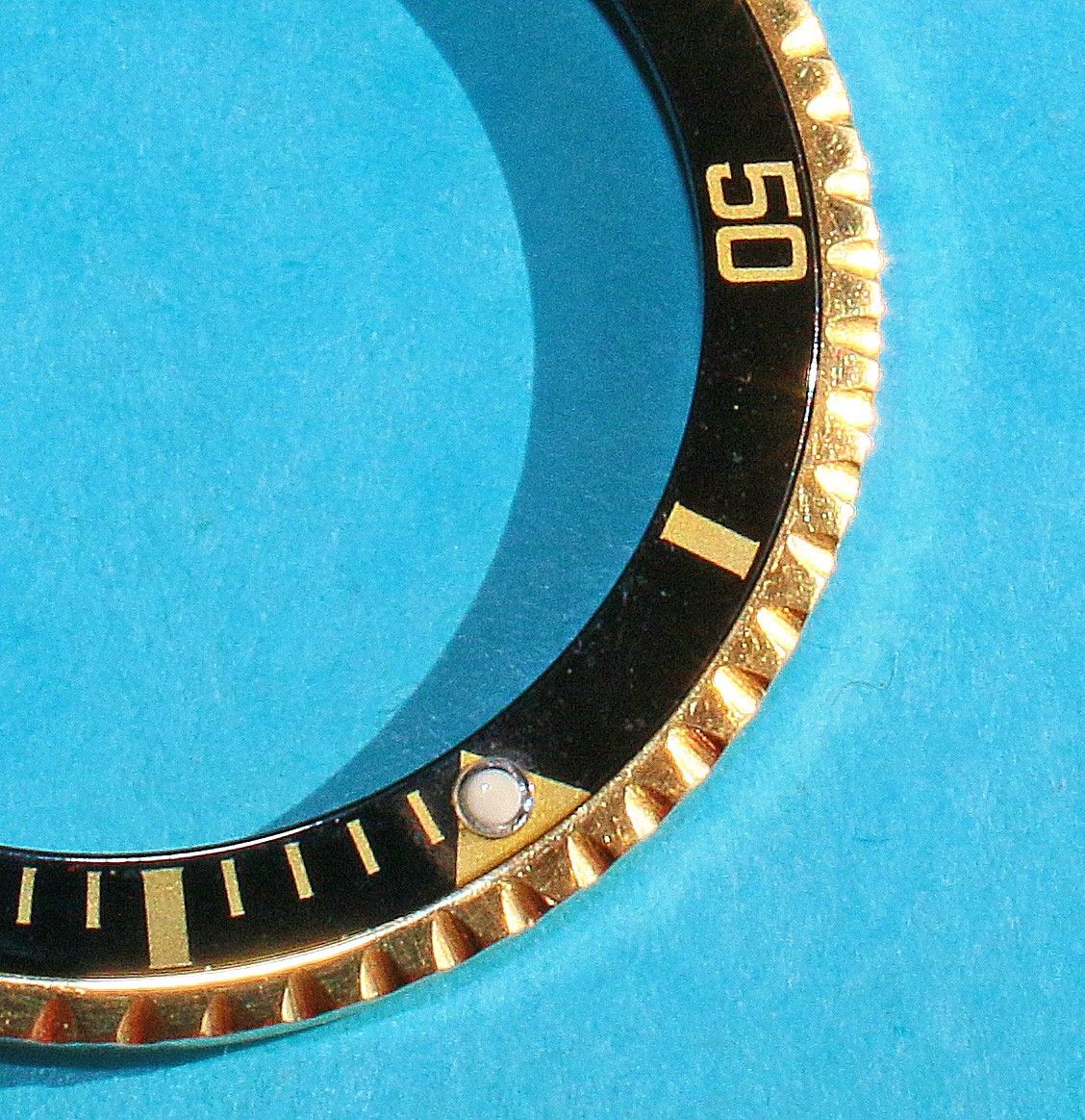 rolex submariner gold bezel